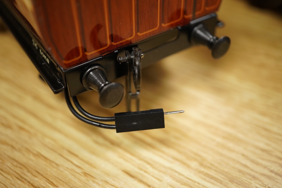 A boxed 0 gauge Darstaed tinplate Metropolitan Railway set of bogie coaches, a rake of five coaches in teak livery including; two Brake Thirds, two Full Thirds, and a Full First, fitted with internal lighting throughout